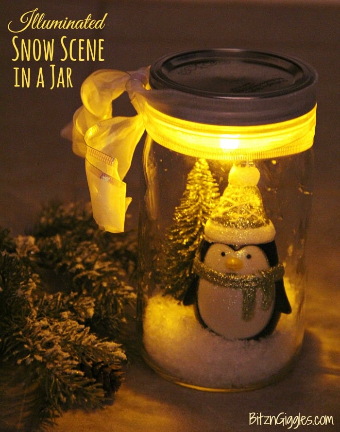 Illuminated Snow Scene in a Jar - An LED tea light illuminates a decorative winter scene inside of a mason jar. Such an easy and beautiful decoration for winter and Christmas!