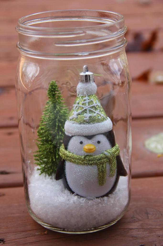 Illuminated Snow Scene in a Jar - An LED tea light illuminates a decorative winter scene inside of a mason jar. Such an easy and beautiful decoration for winter and Christmas!