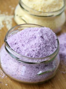 DIY Bath Salts - A super simple and awesome way to show someone you care. Only 5 ingredients and so pretty in an interesting glass jar!