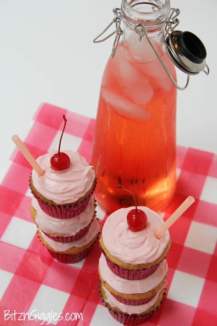 Shirley Temple Cupcakes - Made with Cherry Chip cake mix spiked with lemon-lime soda, filled with a marshmallowy fluff, topped with vanilla buttercream frosting and garnished with a cherry! WOW!