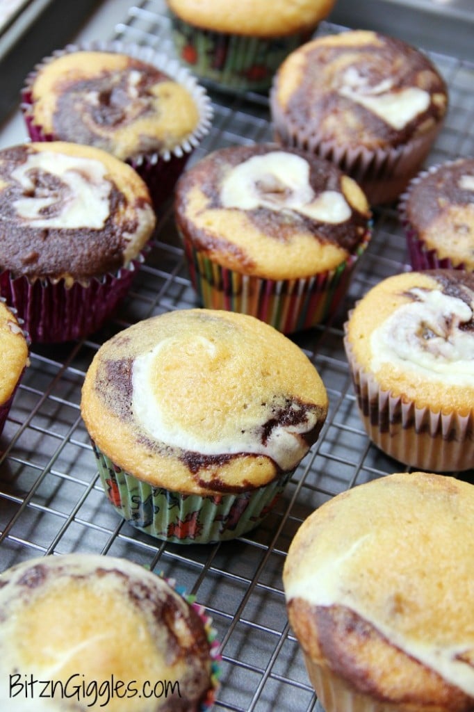 Peanut Butter Oreo and Cream Cupcakes, marble cupcakes with a surprise cream cheese and peanut butter Oreo center, topped with Oreo Peanut Butter & Cream frosting. 