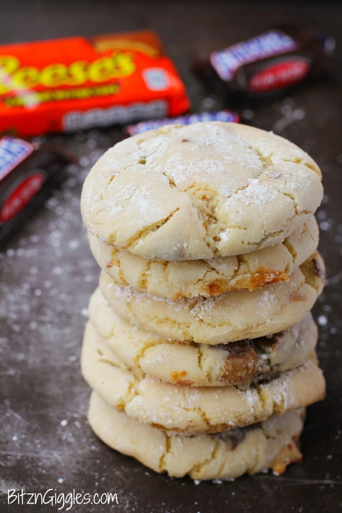 Candy Bar Cookies - Soft and simple cake mix cookies filled with chocolate candy bar pieces and rolled in powdered sugar.