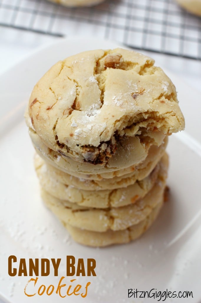 Candy Bar Cookies - Soft and simple cake mix cookies filled with chocolate candy bar pieces and rolled in powdered sugar.