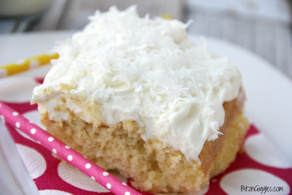 Coconut Poke Cake - A fluffy, moist cake infused with Cream of Coconut and topped with a light and airy cream cheese frosting!