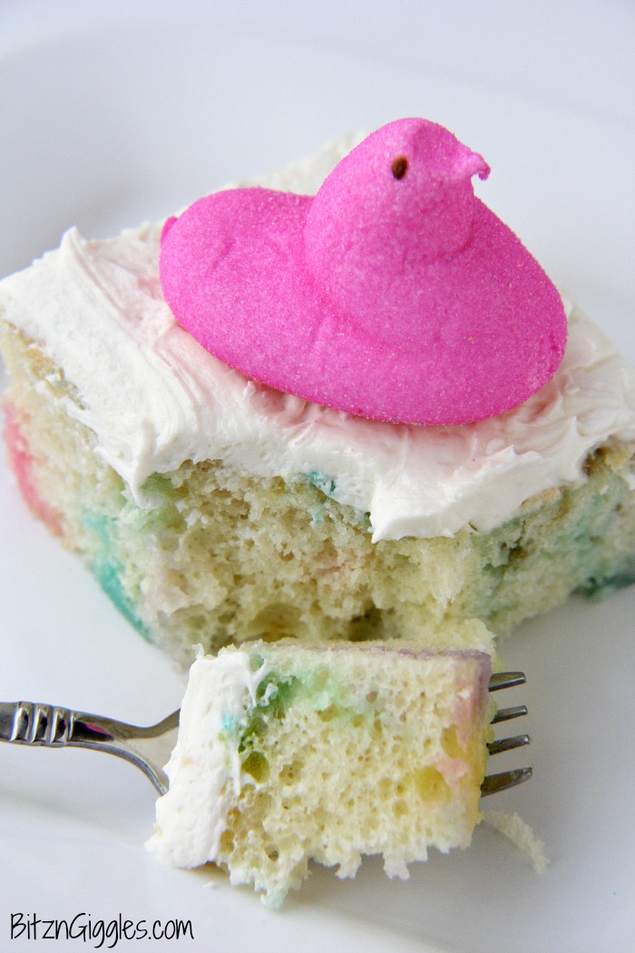 Peeps Cake With Marshmallow Frosting - This cake incorporates bits of Peeps right into the baking process, producing a colorful and slightly sweetened cake with a fluffy, marshmallow frosting that literally melts in your mouth!