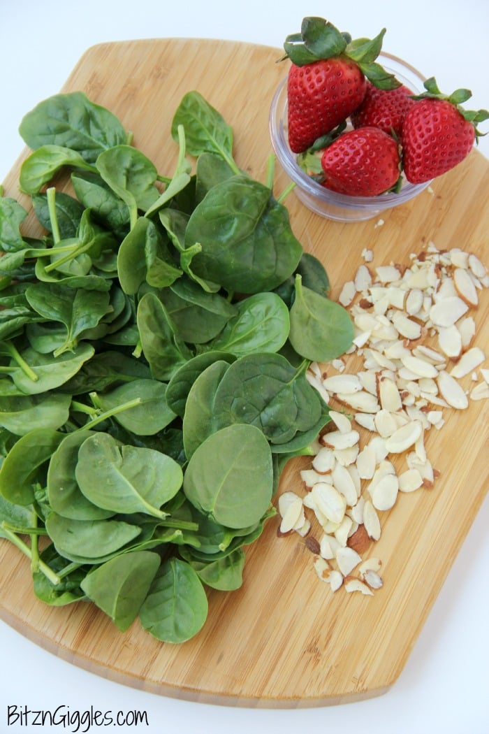 Strawberry Spinach Salad - A delicious, sweet salad with fresh strawberries, spinach and an almond crunch.