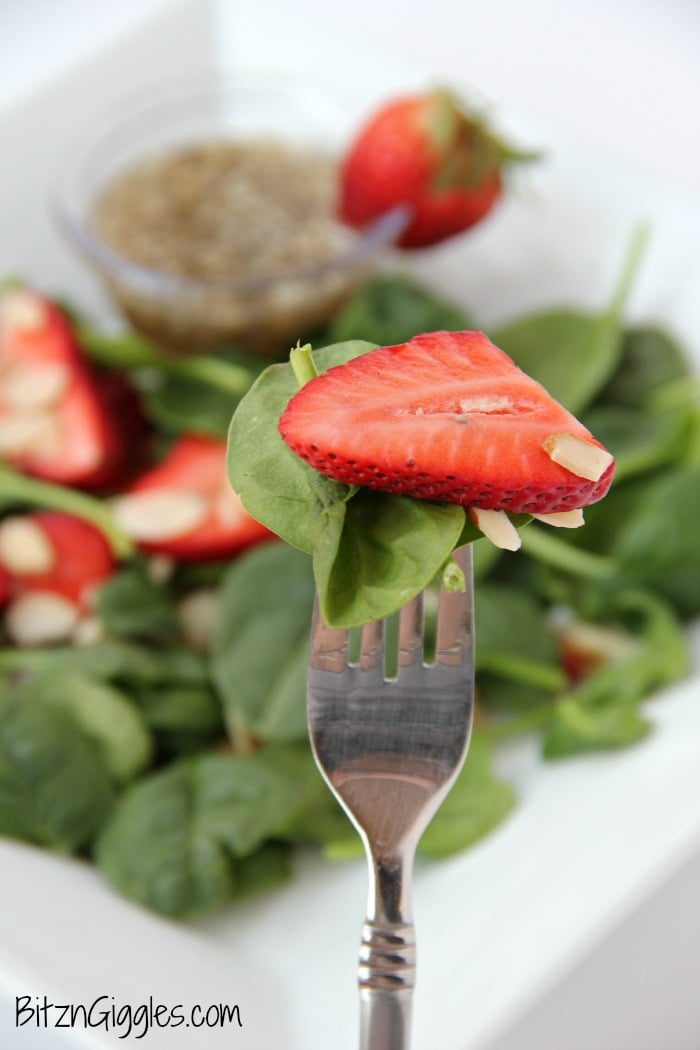 Strawberry Spinach Salad - A delicious, sweet salad with fresh strawberries, spinach and an almond crunch.