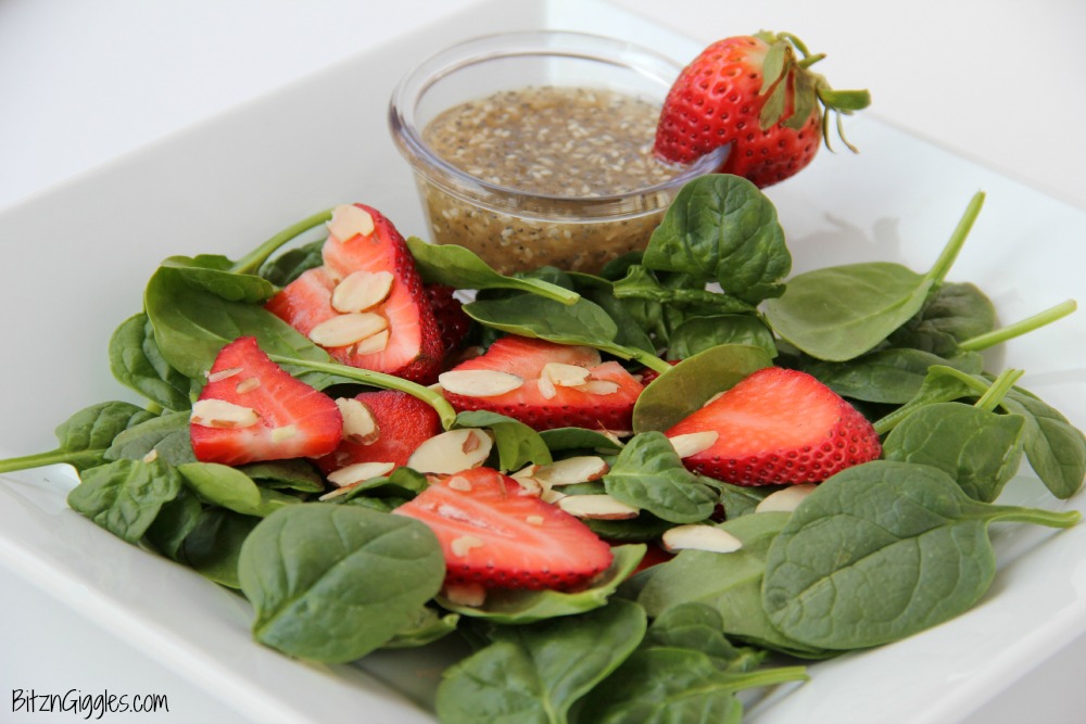 Strawberry Spinach Salad - A delicious, sweet salad with fresh strawberries, spinach and an almond crunch.