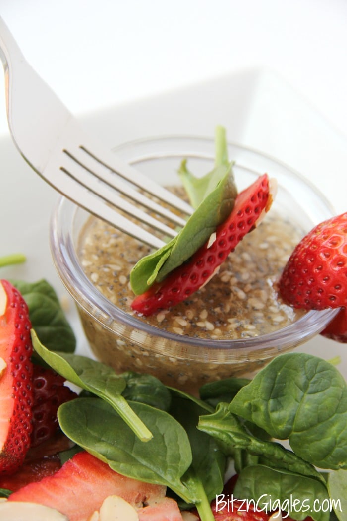 Strawberry Spinach Salad - A delicious, sweet salad with fresh strawberries, spinach and an almond crunch.