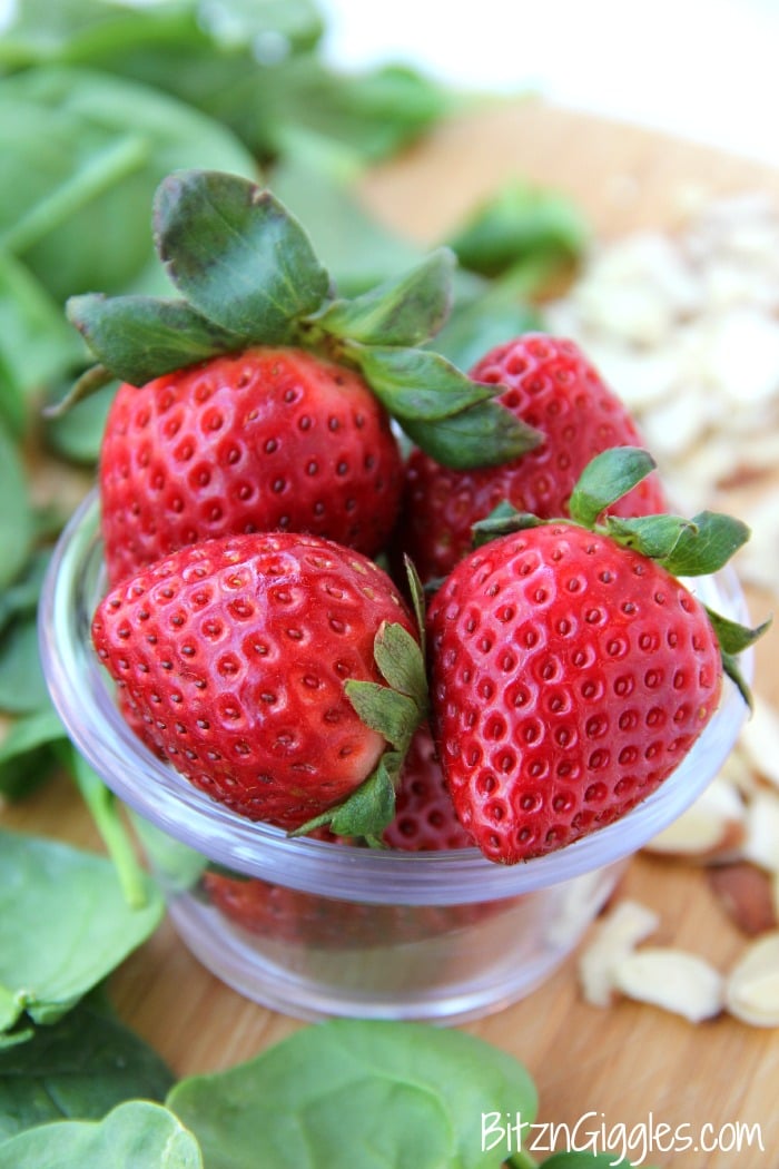 Strawberry Spinach Salad - A delicious, sweet salad with fresh strawberries, spinach and an almond crunch.