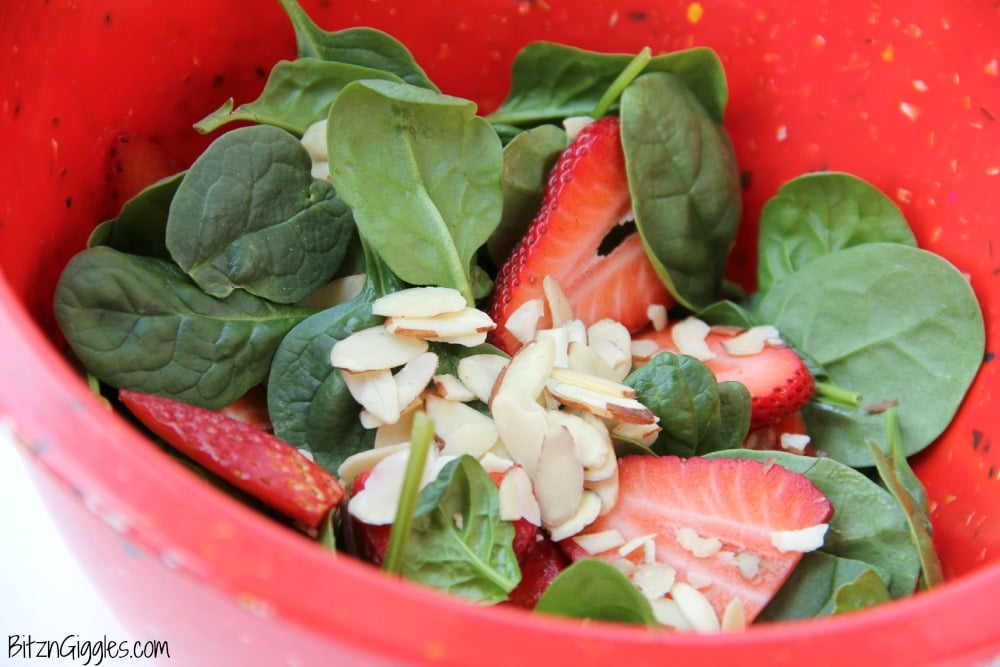 Strawberry Spinach Salad - A delicious, sweet salad with fresh strawberries, spinach and an almond crunch.