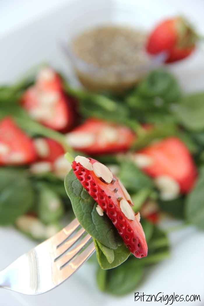Strawberry Spinach Salad - A delicious, sweet salad with fresh strawberries, spinach and an almond crunch.
