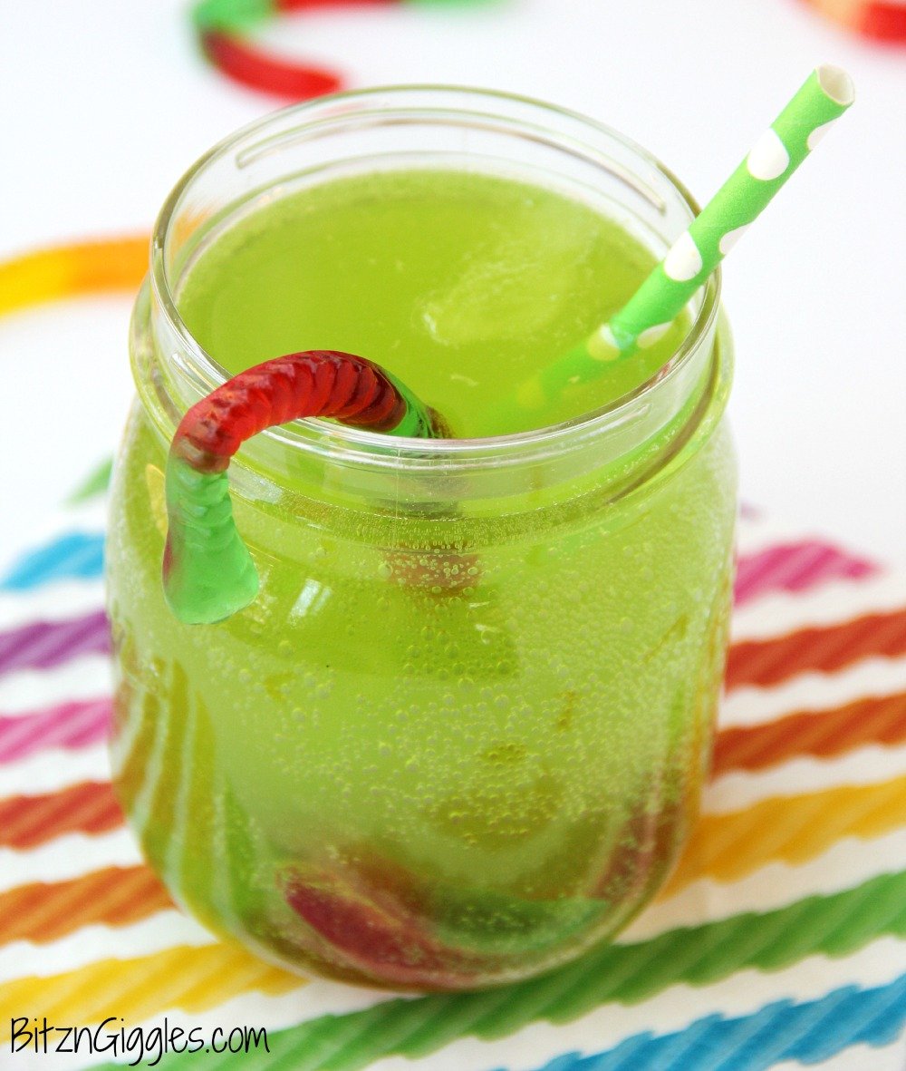 Gummy Worm Punch - Kids will love sipping on this drink in the summer! Great idea for birthday parties, St. Patrick's Day and Halloween, too! Gummy worms are frozen in a punch mixture and emerge from the ice as the drink is enjoyed! So much fun!