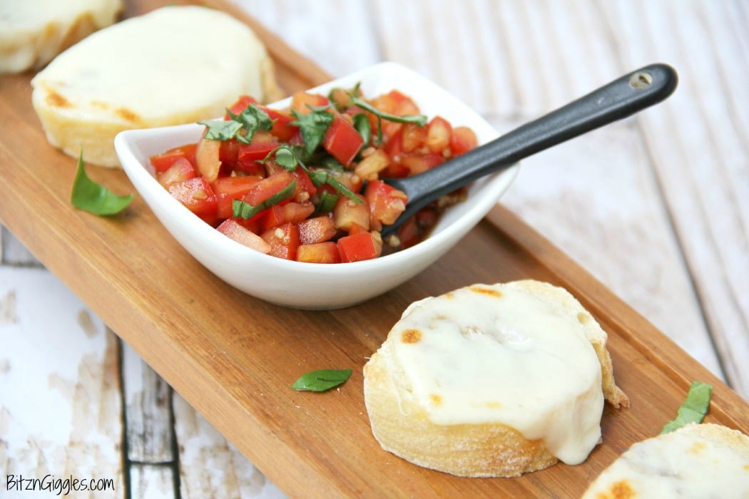 Classic Bruschetta - French bread slices topped with melted mozzarella and fresh tomatoes bursting with flavors of balsamic, garlic and basil!