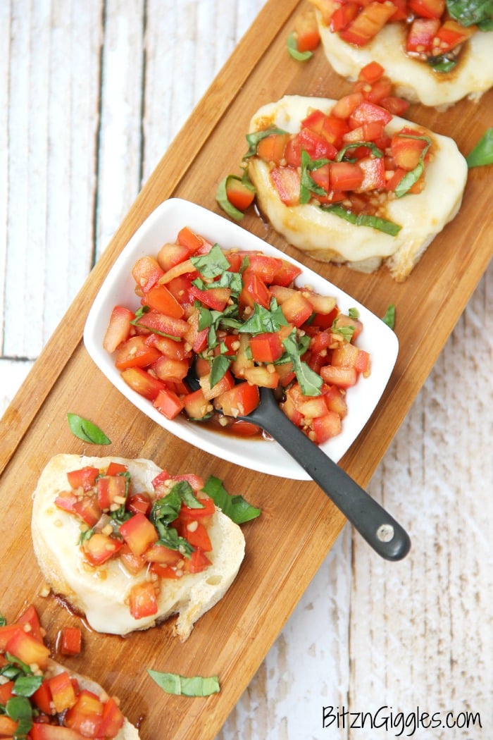 Classic Bruschetta - French bread slices topped with melted mozzarella and fresh tomatoes bursting with flavors of balsamic, garlic and basil!