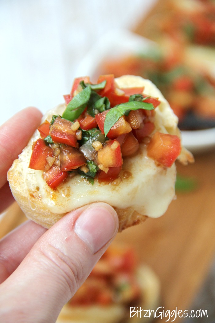 Classic Bruschetta - French bread slices topped with melted mozzarella and fresh tomatoes bursting with flavors of balsamic, garlic and basil!
