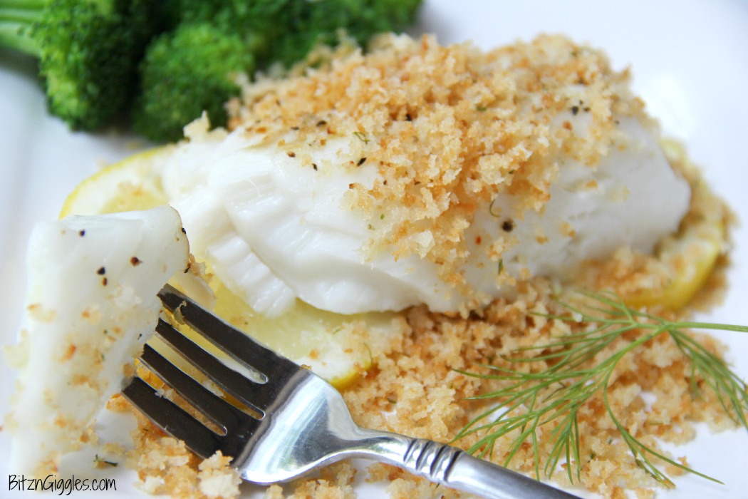 Lemon Baked Cod - Flaky white cod baked on top of lemon slices and then topped off with panko crumbs. . . bursting with flavors of lemon and dill.