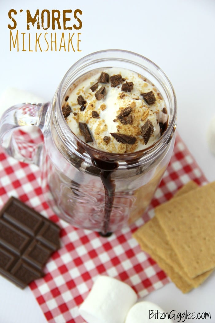 S'mores Milkshake - Alternating layers of marshmallow fluff and chocolate ice cream combine to create a decadent and delicious shake topped off with crushed graham crackers and chocolate!