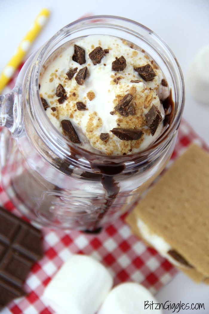 S'mores Milkshake - Alternating layers of marshmallow fluff and chocolate ice cream combine to create a decadent and delicious shake topped off with crushed graham crackers and chocolate!