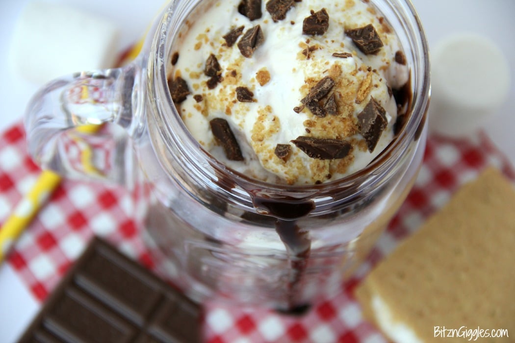 S'mores Milkshake - Alternating layers of marshmallow fluff and chocolate ice cream combine to create a decadent and delicious shake topped off with crushed graham crackers and chocolate!