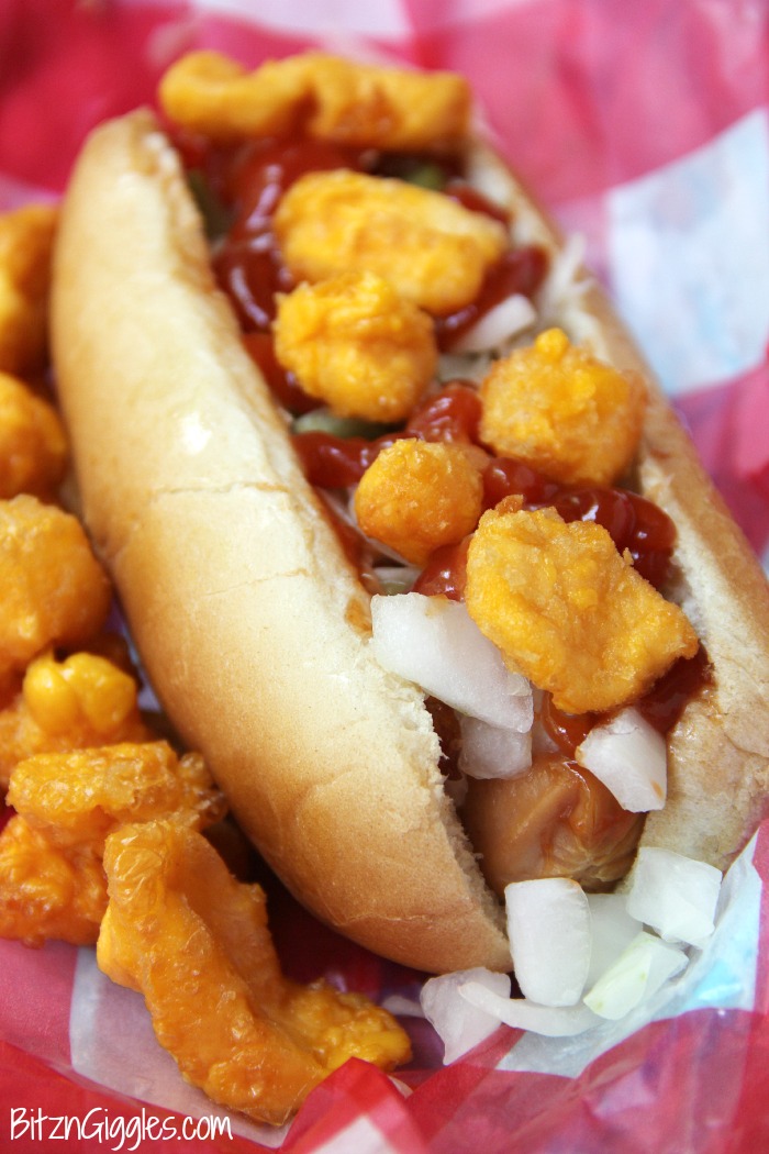 Cheese Curd Dogs -A family favorite with Wisconsin charm! Chopped onions, pickles, sauerkraut and cheese curds make this dog irresistible!