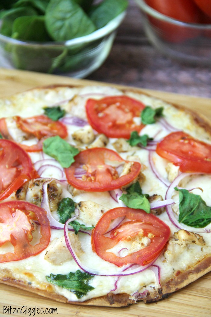 Chicken Ranch Tortilla Pizza - A quick and delicious "skinny" pizza with sprinkles of grilled chicken and fresh vegetables, bursting with mouth-watering garlic and ranch flavors!