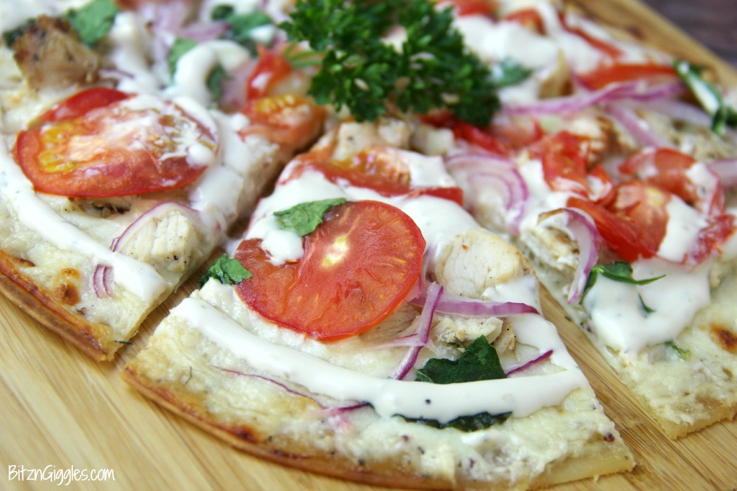 Chicken Ranch Tortilla Pizza - A quick and delicious "skinny" pizza with sprinkles of grilled chicken and fresh vegetables, bursting with mouth-watering garlic and ranch flavors!