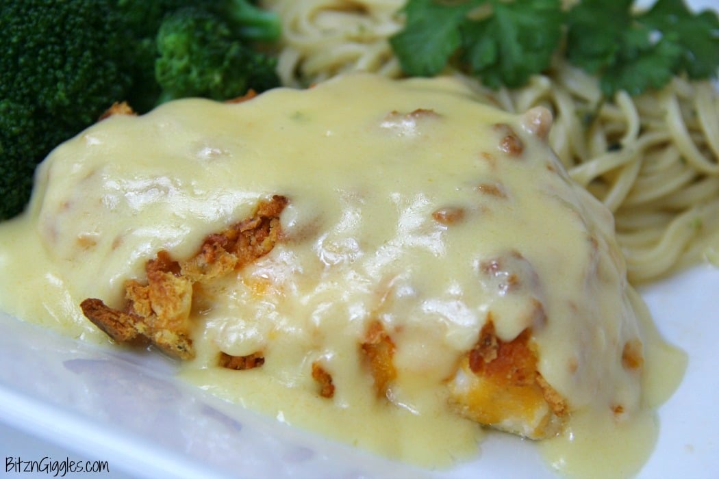 Ritz Cracker Chicken - Cheesy chicken covered with crispy, baked Ritz Crackers and topped with a creamy, flavorful sauce!