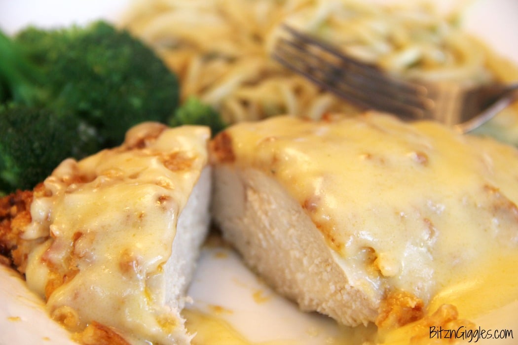 Ritz Cracker Chicken - Cheesy chicken covered with crispy, baked Ritz Crackers and topped with a creamy, flavorful sauce!