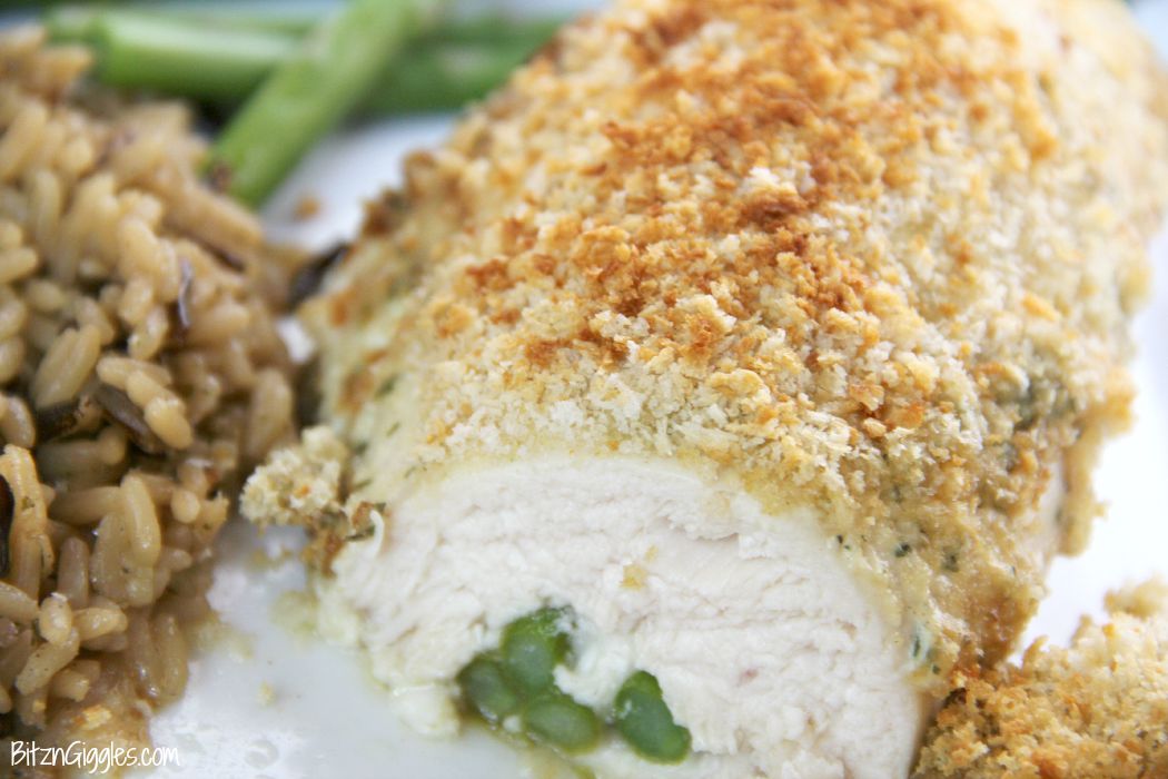 Chicken Asparagus Roll-Ups - Deliciously moist and cheesy chicken breasts rolled around asparagus spears and covered with a hollandaise-like sauce. Crunchy panko crumbs top off this elegant dish.