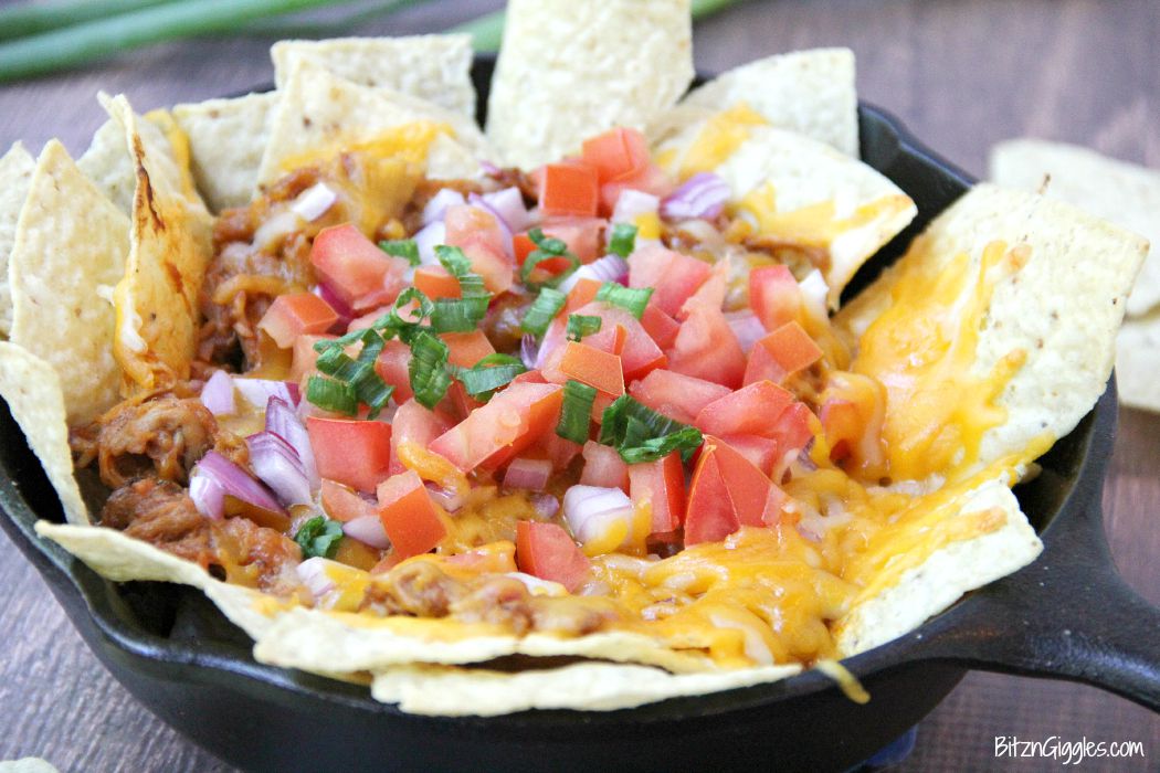Pulled Pork Nachos - These nachos can serve as either an appetizer or a meal and come together simply and quickly so you can enjoy the party too!