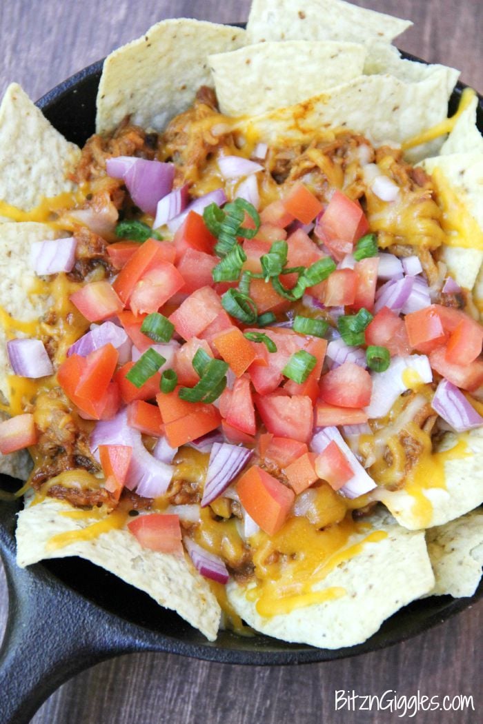 Pulled Pork Nachos - These nachos can serve as either an appetizer or a meal and come together simply and quickly so you can enjoy the party too!