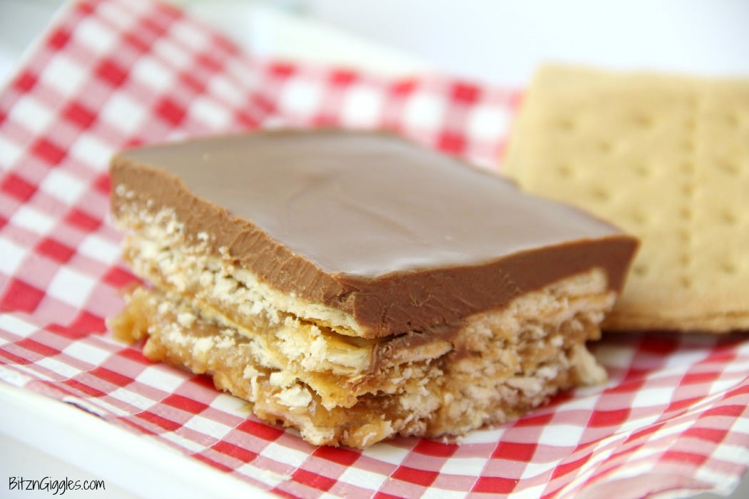 Peanut Butter Fudge Cracker Bars - A sweet and salty cracker layered dessert covered in rich peanut butter chocolate fudge!