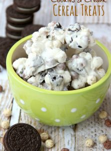 Cookies and Cream Cereal Treats - White chocolate clusters of Oreo pieces, marshmallows and cookies and cream cereal! All you need is a microwave and a couple minutes to whip up these delicious and simple treats!