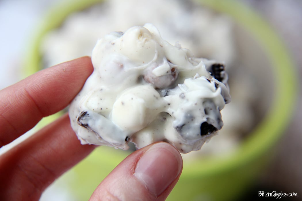 Cookies and Cream Cereal Treats - White chocolate clusters of Oreo pieces, marshmallows and cookies and cream cereal! All you need is a microwave and a couple minutes to whip up these delicious and simple treats!