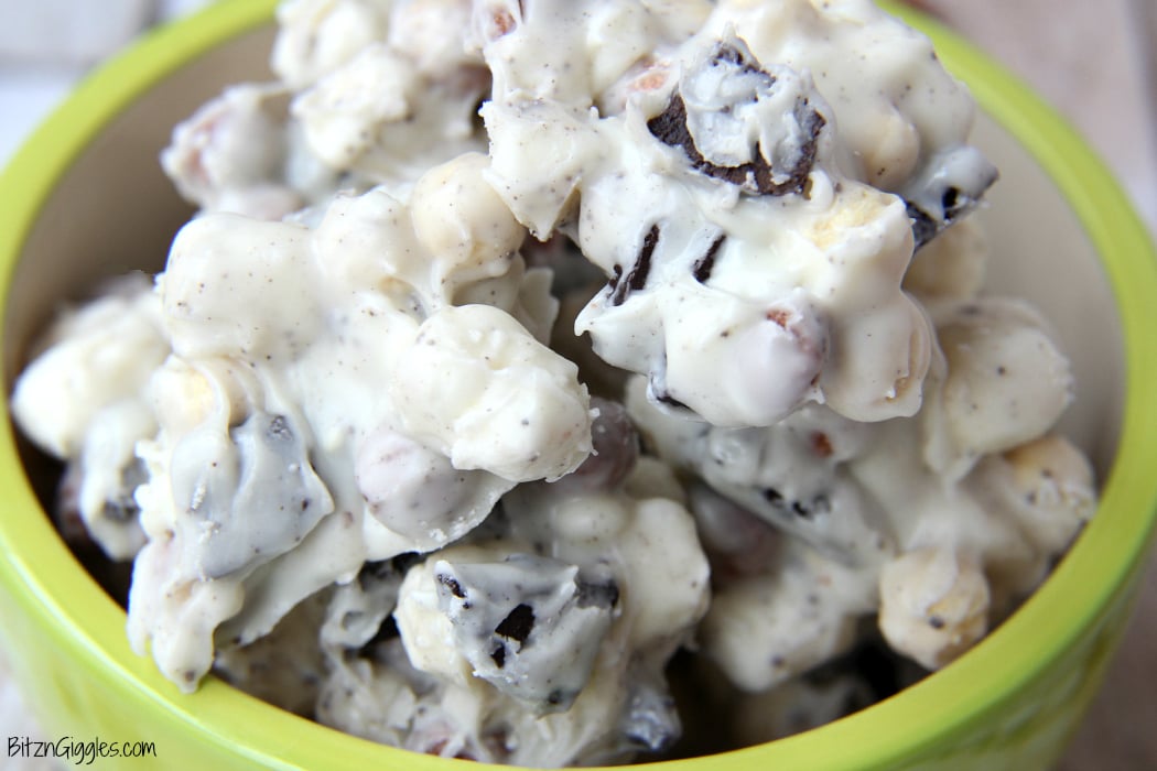 Cookies and Cream Cereal Treats - White chocolate clusters of Oreo pieces, marshmallows and cookies and cream cereal! All you need is a microwave and a couple minutes to whip up these delicious and simple treats!