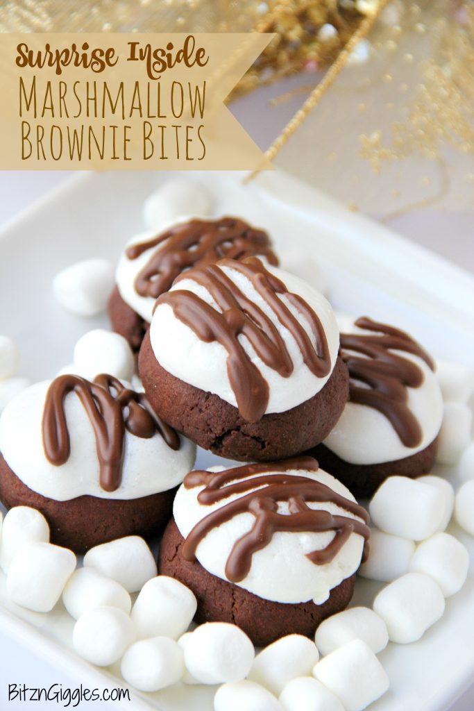 Surprise Inside Marshmallow Brownie Bites - Bite-sized brownie cookies filled with a caramel center and topped with marshmallow and chocolate drizzle!