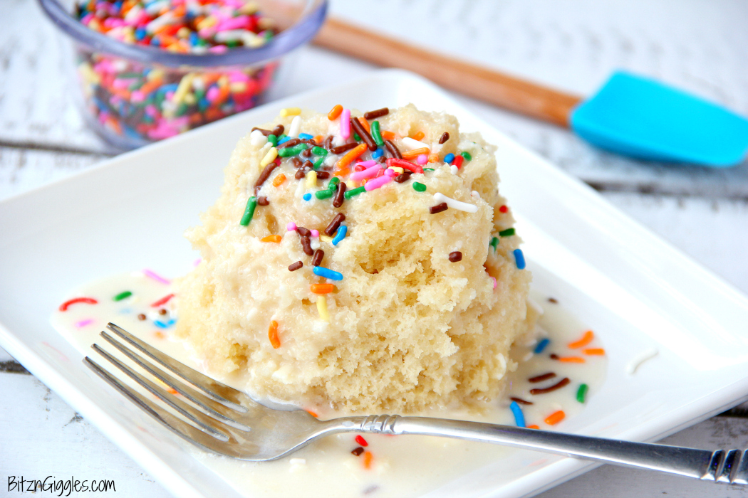 Vanilla Mug Cake - Ready in 90 seconds! This mug cake is moist, delicious and topped with a lovely vanilla icing that soaks into the cake and infuses it with sweetness! #mugcake #vanillacake #recipe #easymugcake #microwavedessert #bitzngiggles