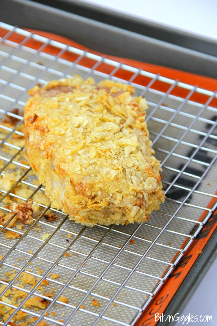 Potato Chip Pork Chops - Seasoned pork chops dredged in buttermilk with a crunchy and delicious potato chip crust!