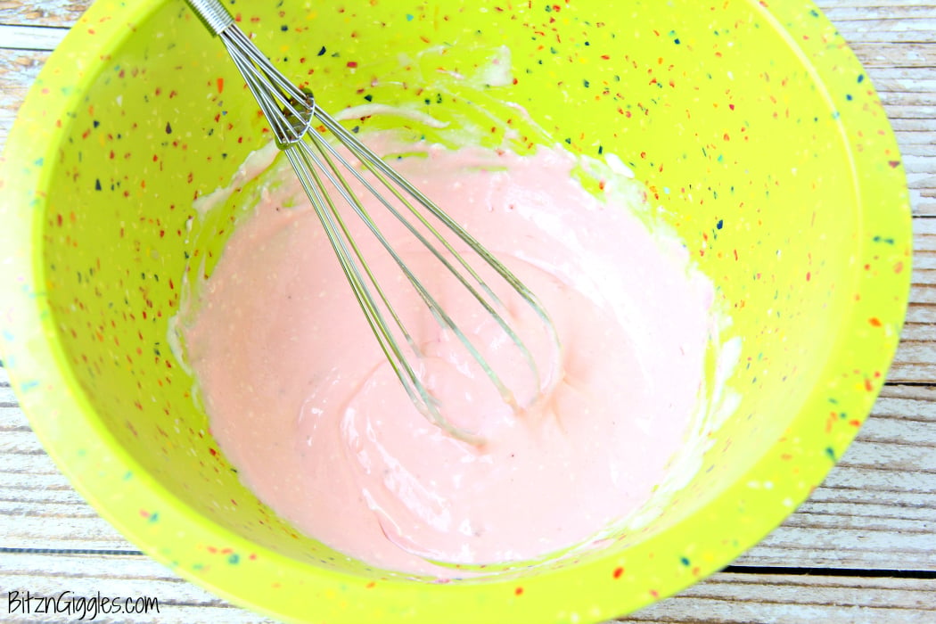 Strawberry Shortcake Dip - This dip comes together in minutes! Swirl in your favorite strawberry jam, cut up some fruit and cake and start dipping!