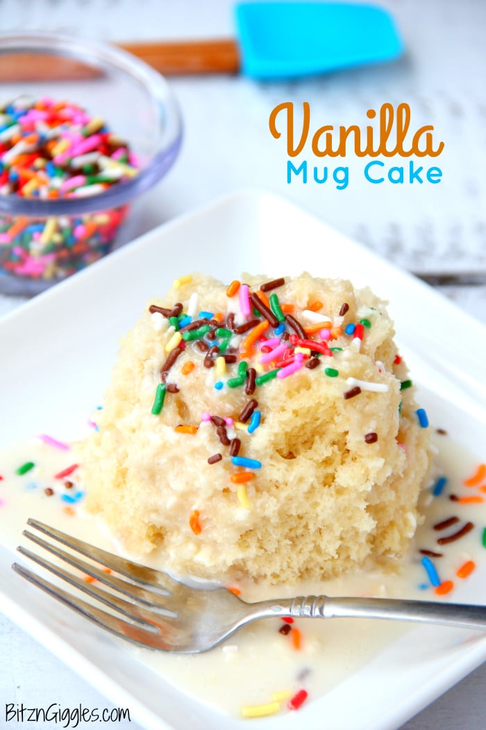 Vanilla Mug Cake - Ready in 90 seconds! This mug cake is moist, delicious and topped with a lovely vanilla icing that soaks into the cake and infuses it with sweetness! #mugcake #vanillacake #recipe #easymugcake #microwavedessert #bitzngiggles