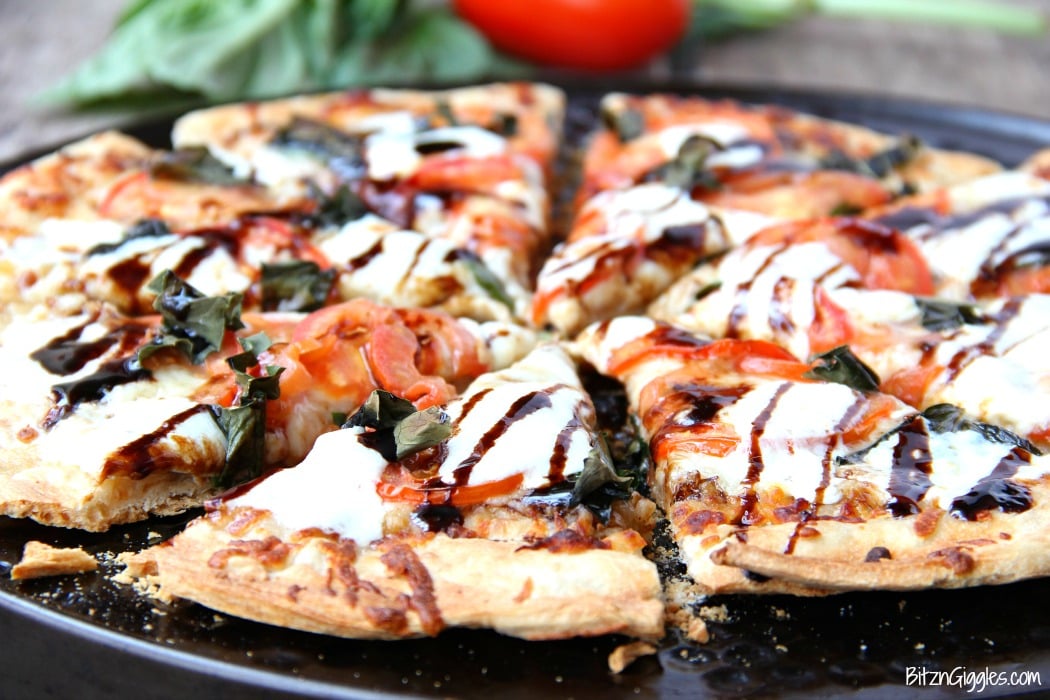 Caprese Pizza - Fresh tomatoes, basil, mozzarella and a sweet balsamic glaze makes this quite possibly the best pizza on the planet!