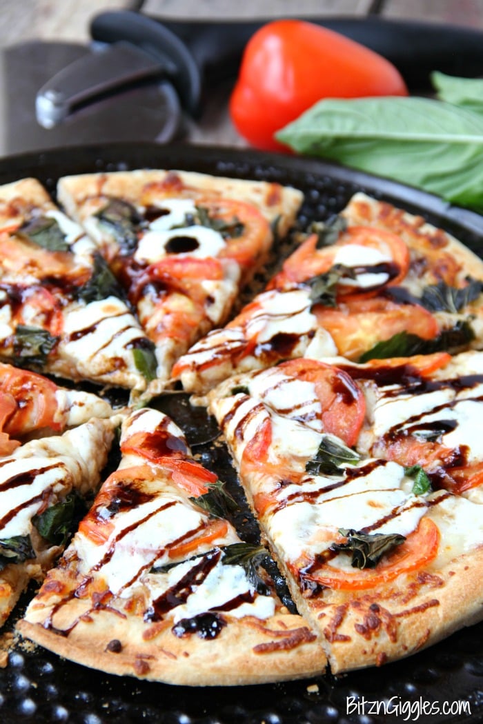 Caprese Pizza - Fresh tomatoes, basil, mozzarella and a sweet balsamic glaze makes this quite possibly the best pizza on the planet!