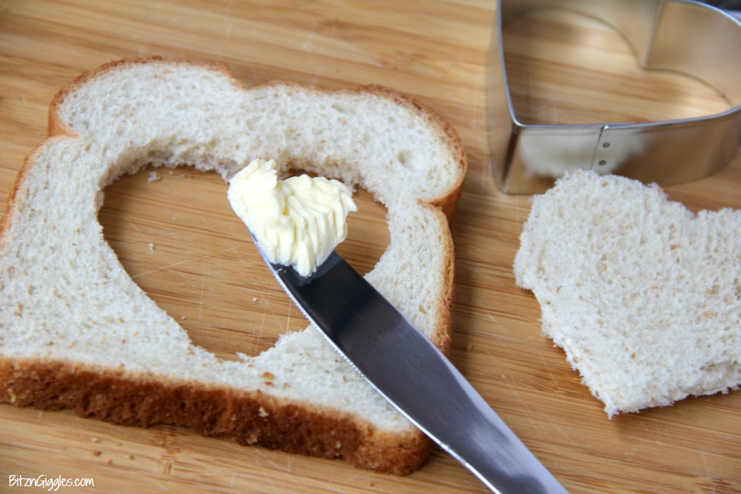 Easy Egg in a Hole - Such a fun way to enjoy eggs and toast! Make it extra special by using a heart-shaped cookie cutter!