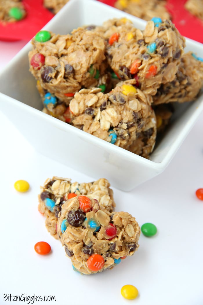 M&M Granola Bites - These granola bites are a family favorite, made with peanut butter, honey, M&Ms and chocolate chips! I used a silicone pan with heart-shaped molds to make a creative Valentine's Day dessert. Use any kind of mold you like!