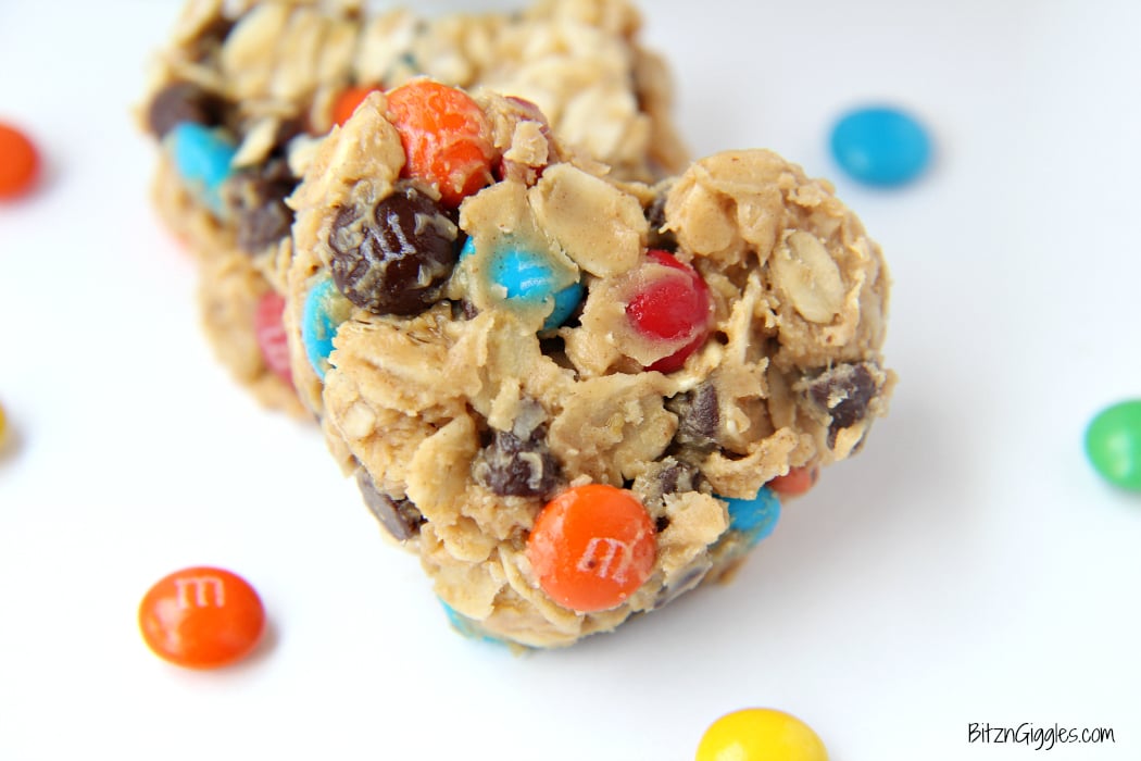 M&M Granola Bites - These granola bites are a family favorite, made with peanut butter, honey, M&Ms and chocolate chips! I used a silicone pan with heart-shaped molds to make a creative Valentine's Day dessert. Use any kind of mold you like!