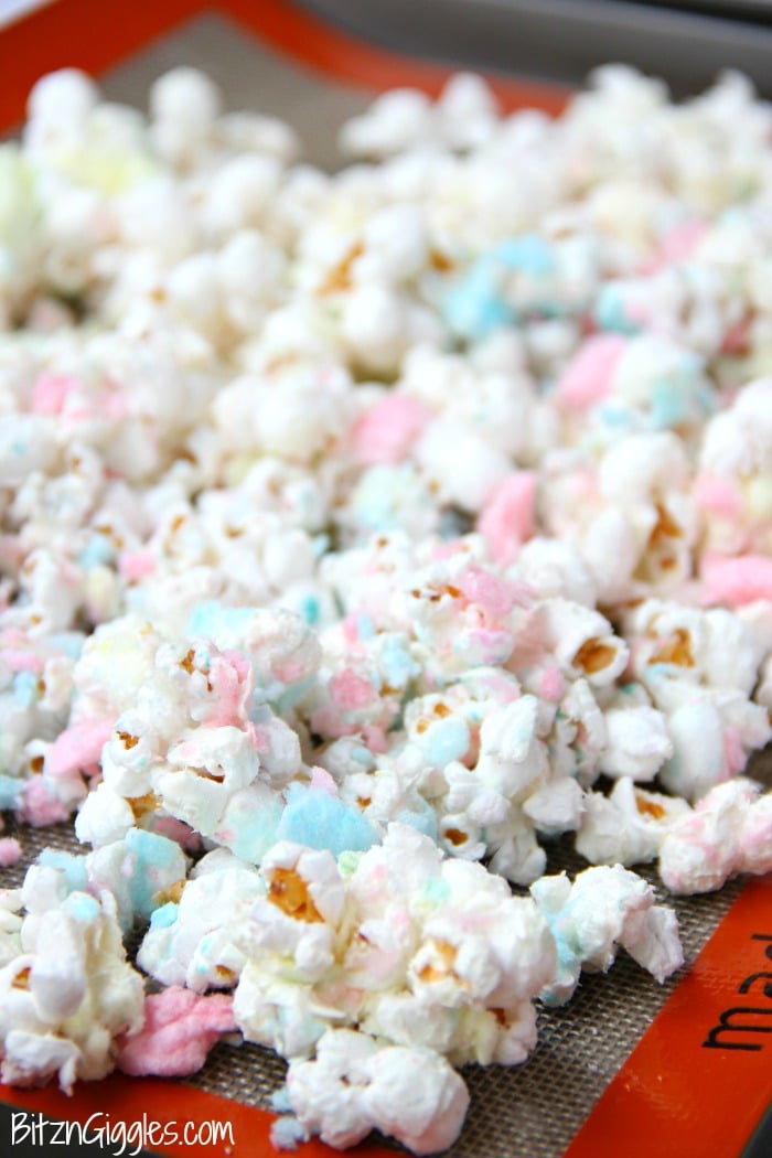 Cotton Candy Popcorn - Candy coated popcorn recipe with sprinkles and real cotton candy pieces!