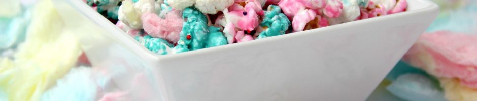 Cotton Candy Popcorn - Candy coated popcorn recipe with sprinkles and real cotton candy pieces!