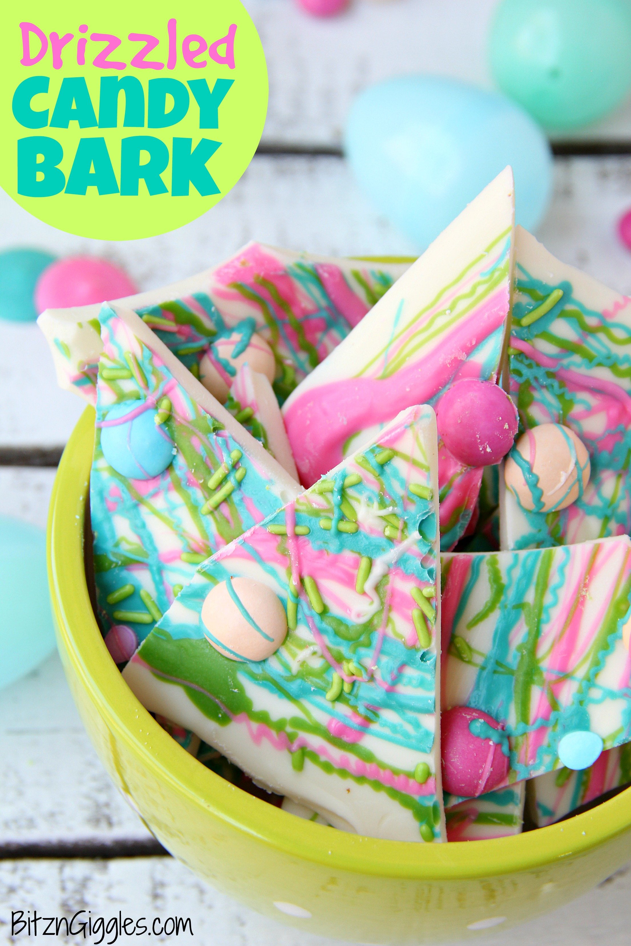 Drizzled Candy Bark - A fun twist on traditional candy bark with M&Ms, sprinkles and colored candy coating drizzle! Perfect for spring and Easter!