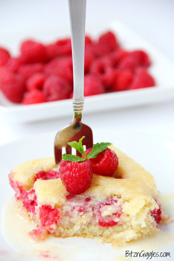 Warm Raspberry Cake with Vanilla Glaze - just like your mom used to make! A delicious cake with fresh raspberries baked in and topped with a sweet vanilla glaze!